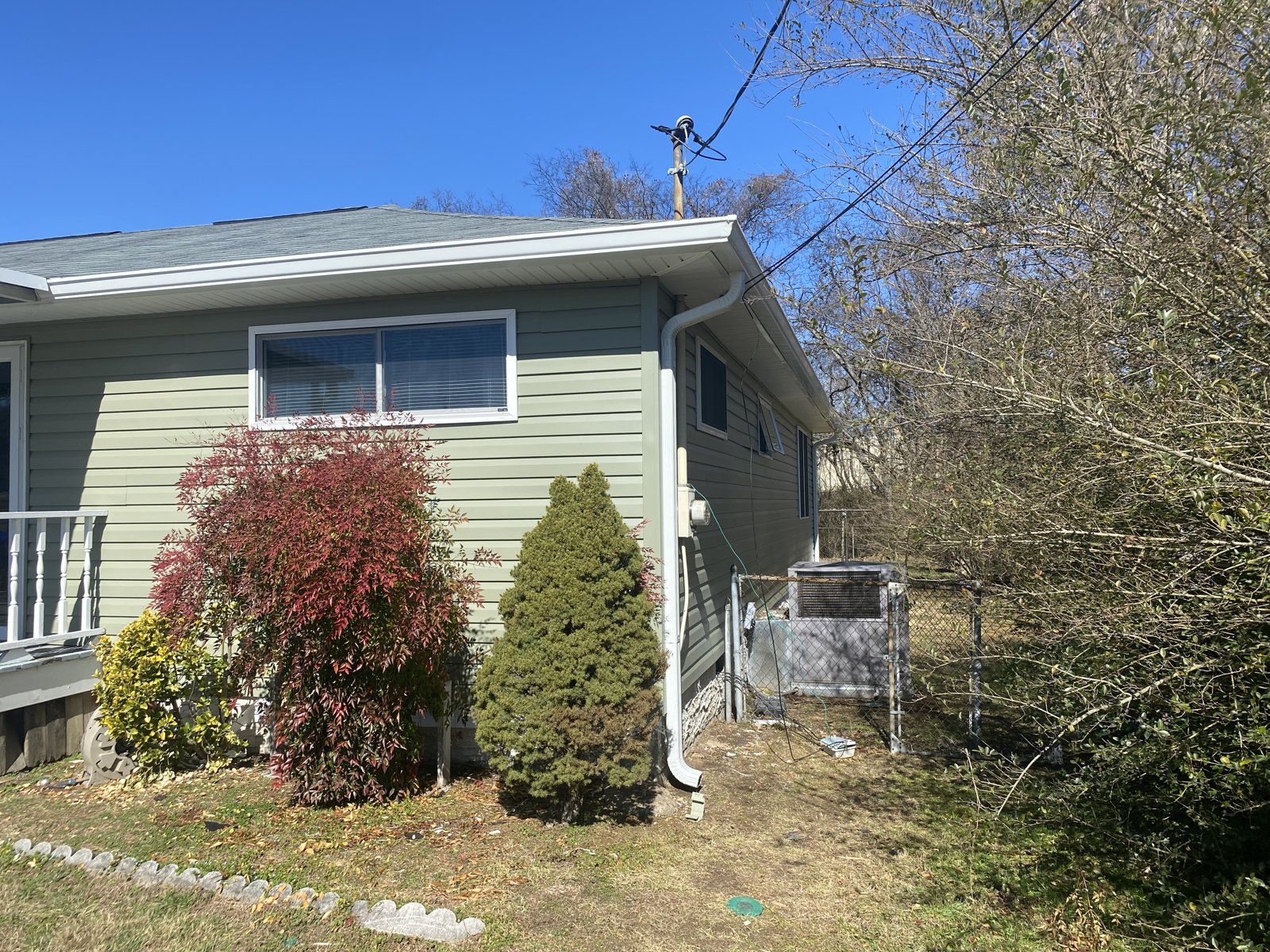 Long single-story home with deck and new seamless gutters in Chickamauga, GA