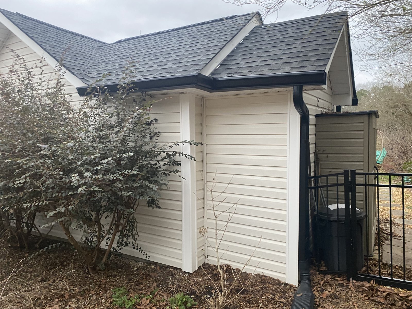Modern white home with attached garage and seamless gutters in East Brainerd, TN