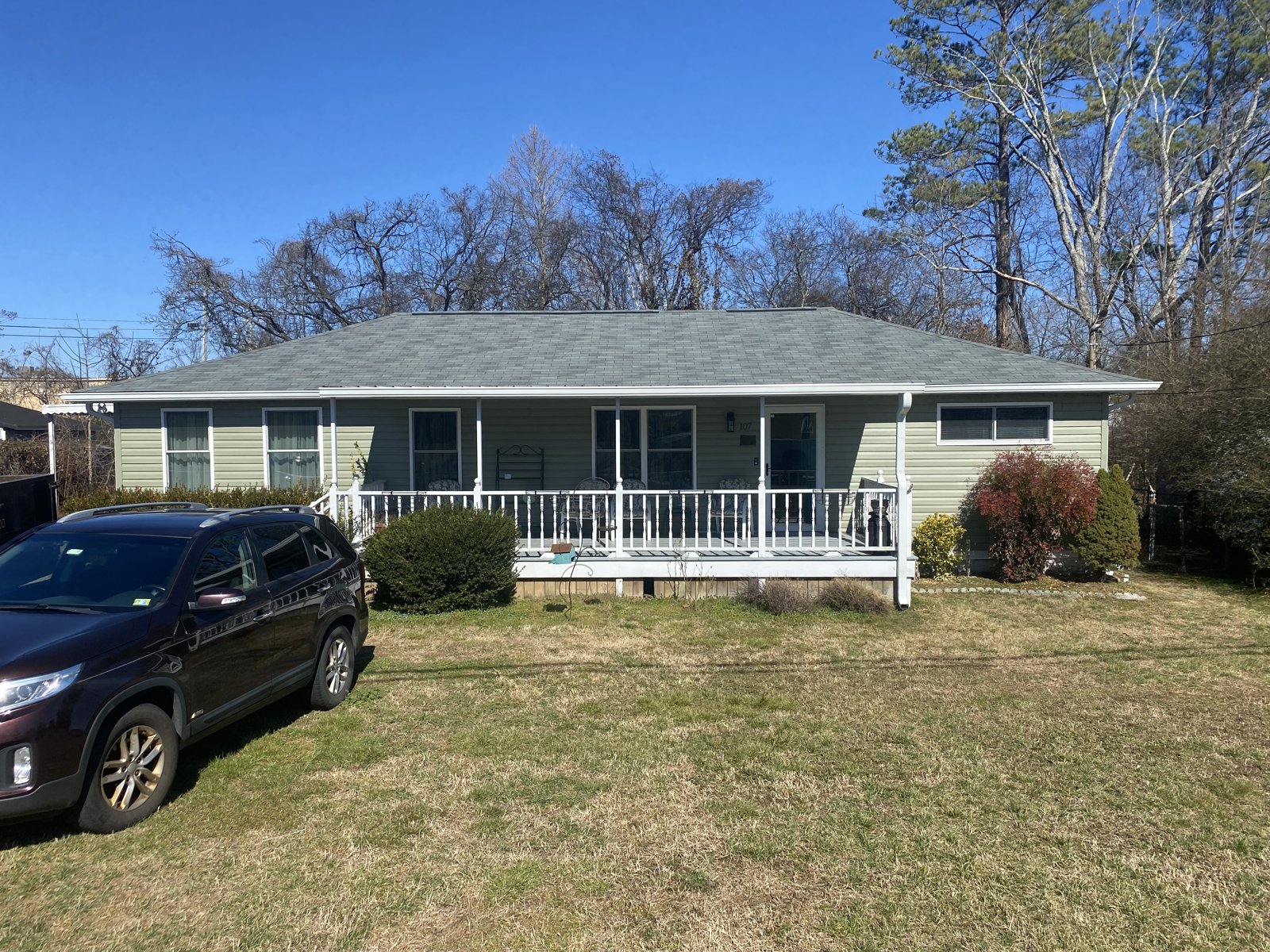 Modern farmhouse porch with seamless gutters in Hixson, TN