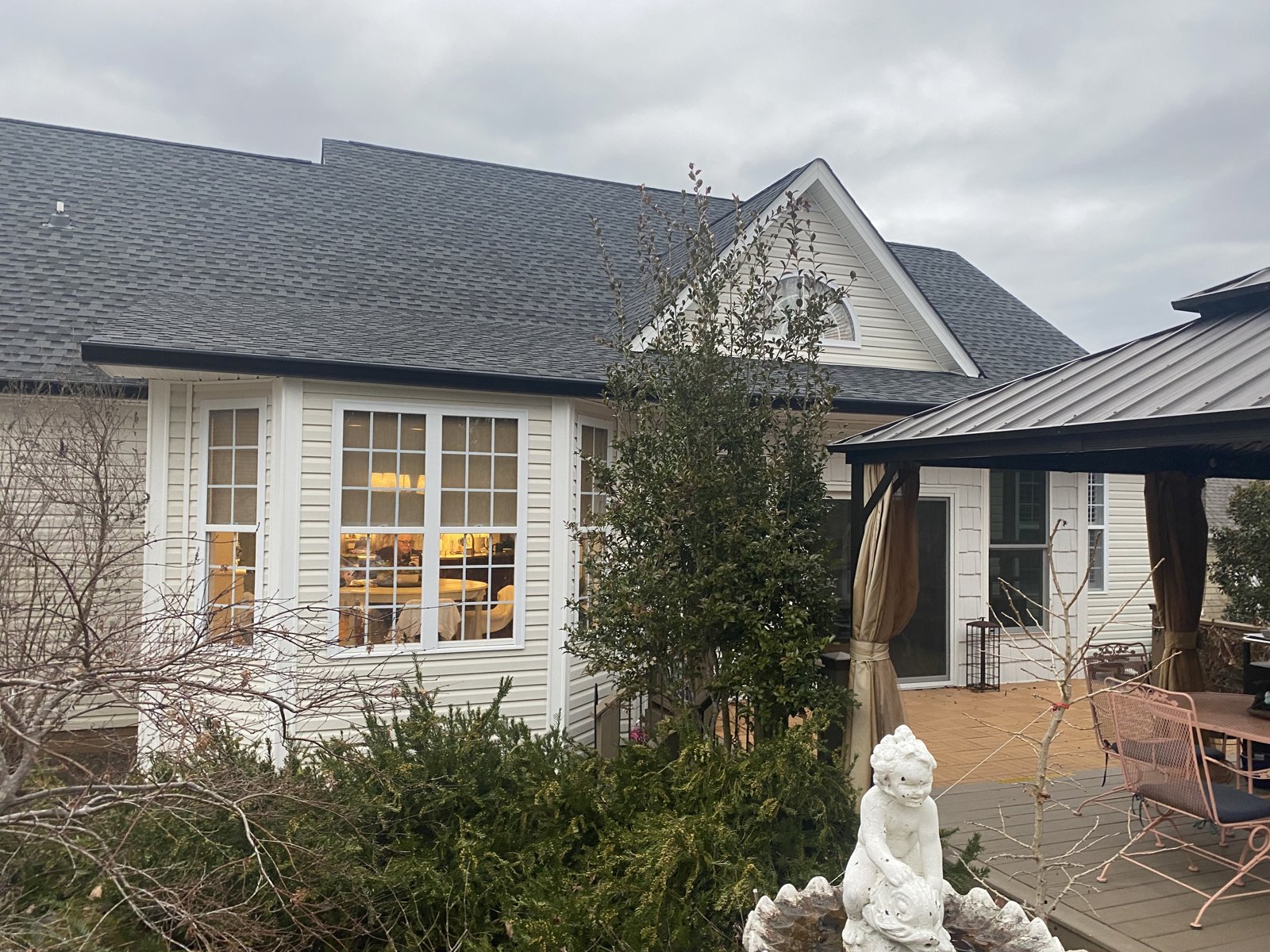 Modern home with attached garage and seamless gutters in Rossville, GA