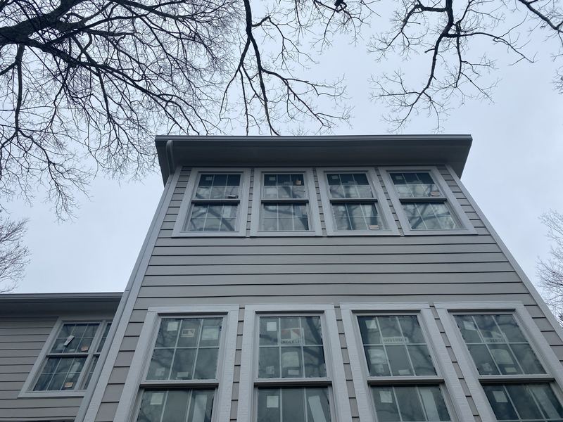 Three-story modern home with seamless gutters