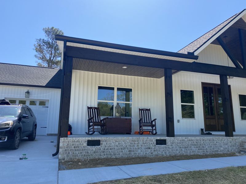 Farmhouse porch with new gutters