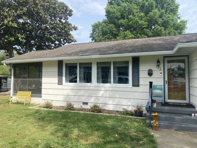 Traditional tan home gutter installation