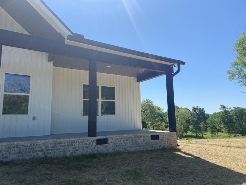 White ranch home with new seamless gutters in Chattanooga