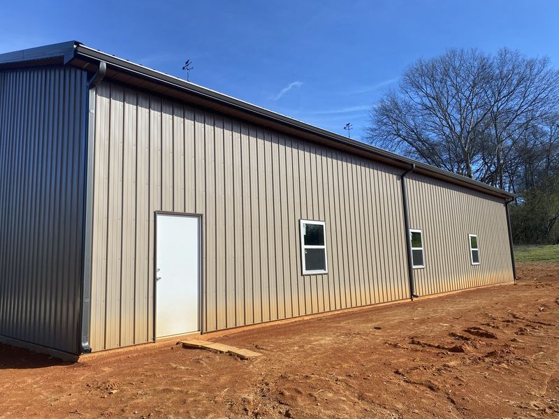 Commercial metal building gutter installation