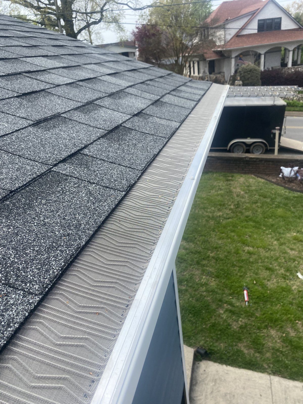 Gutter guards installed along a roofline by Riverbend Gutter Company
