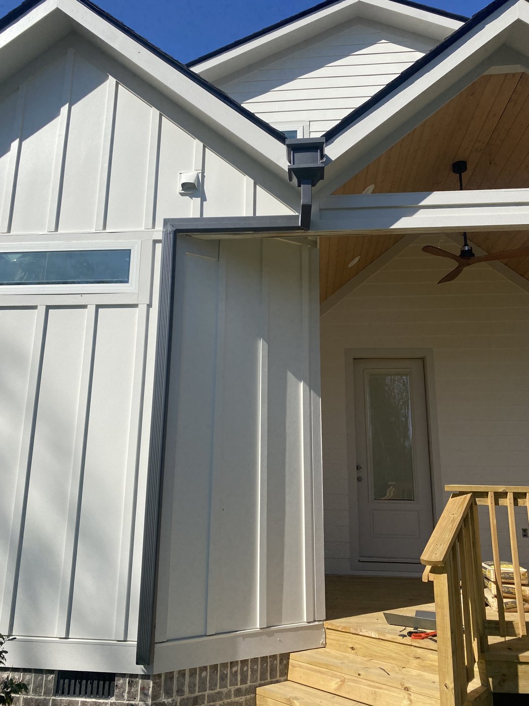 Home with seamless gutters and downspouts repaired by Riverbend Gutter Company