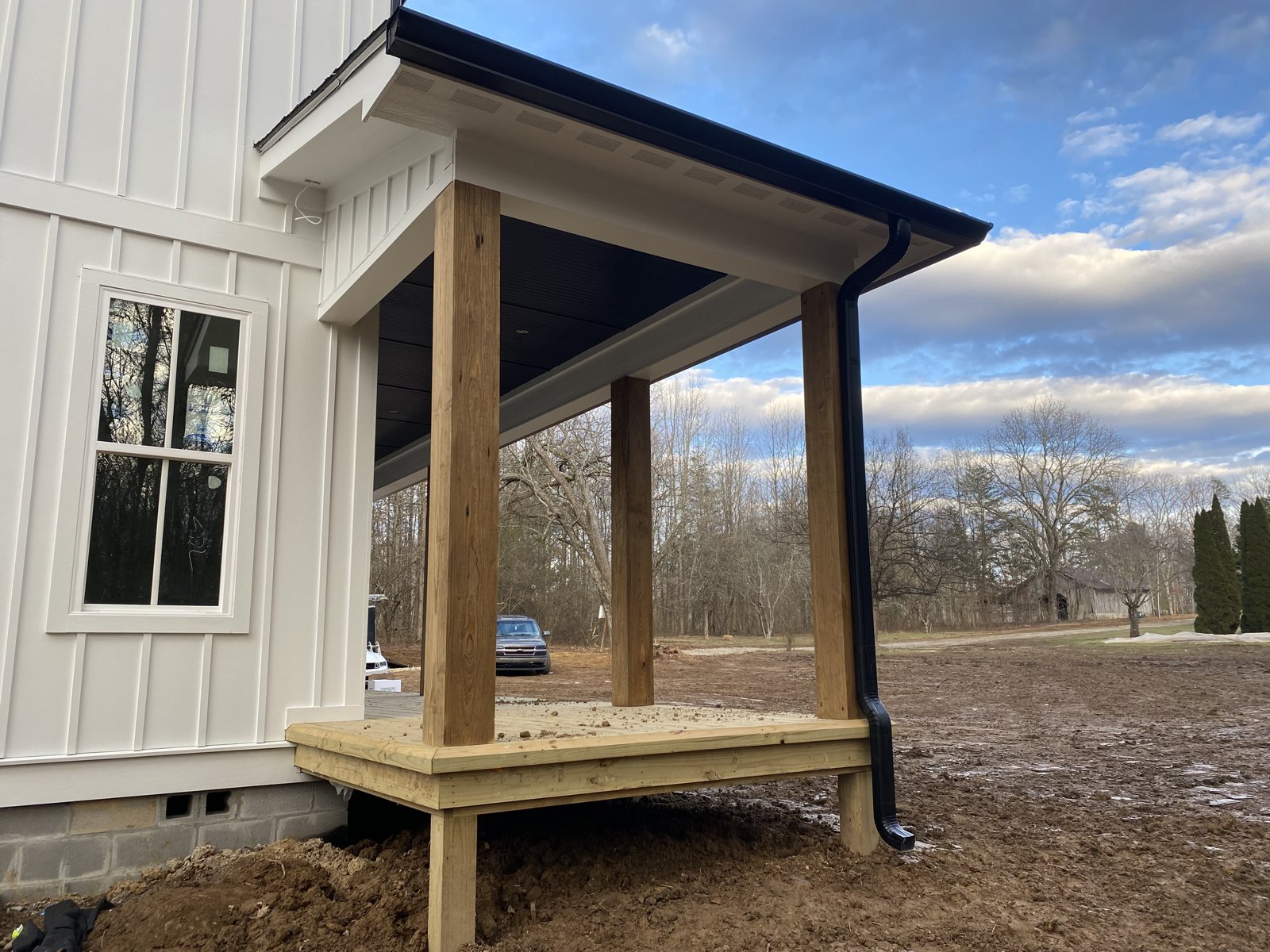 Covered porch with new seamless gutters on a Chattanooga home