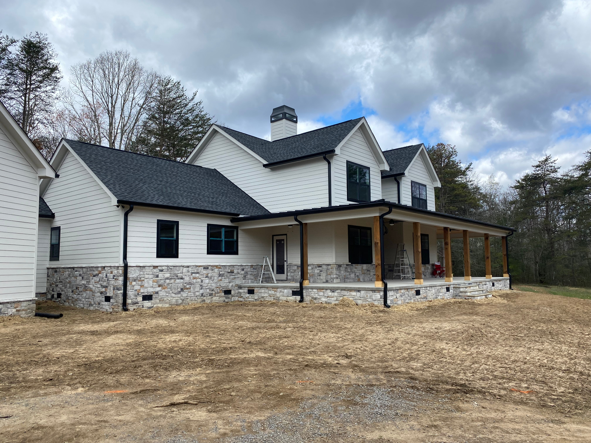 Contemporary home construction with professional gutter system installation